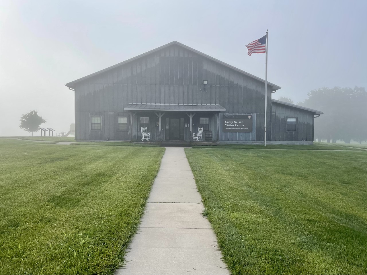 A wooden building covered with fog