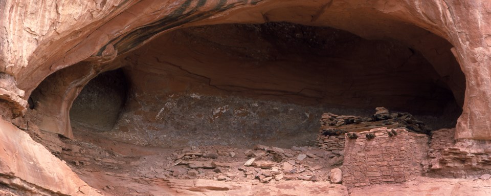 a stone structure in a rock alcove