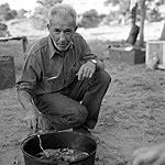 Bates Wilson preparing one of his famous dutch oven breakfasts.