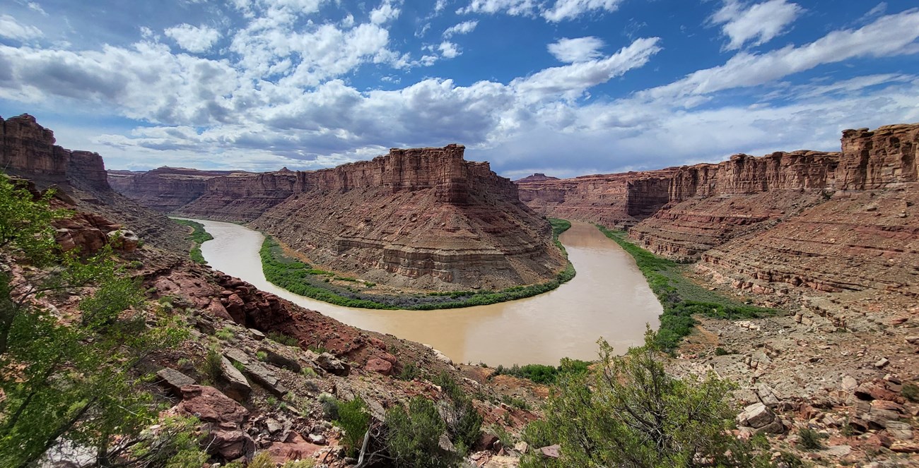 A view of a river curving between canyons