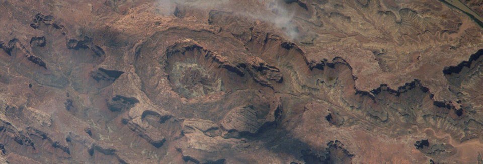 an aerial view of a crater