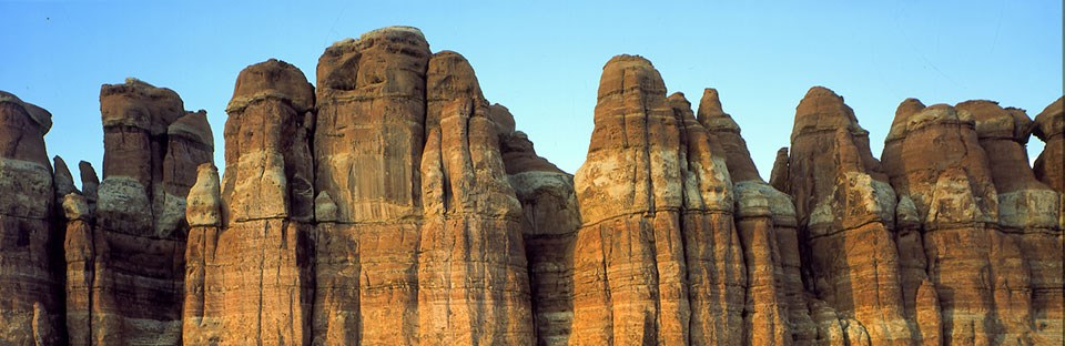 spires of sandstone with horizontal white and orange bands