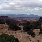 A canyon view with mountains in the background.