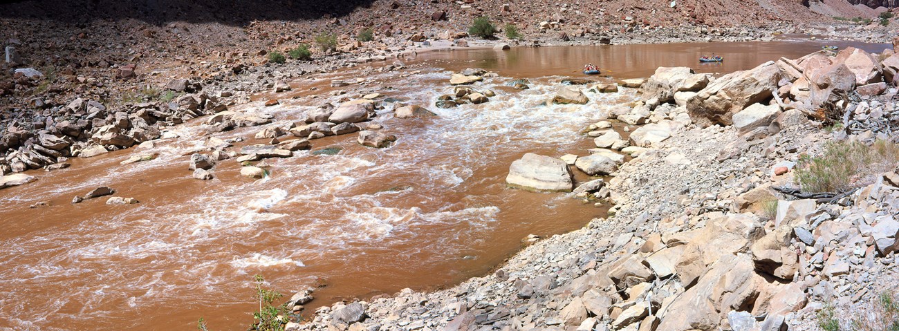 Rapids with boaters dropping in