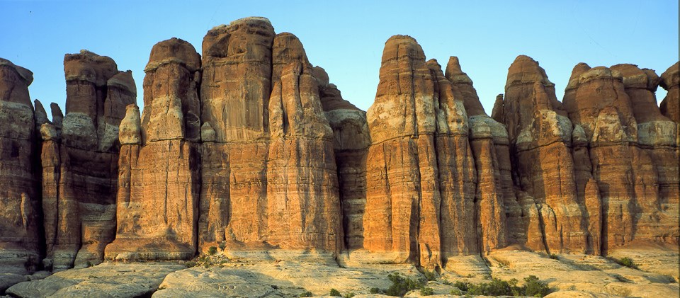 tall spires of sandstone with bands of white and red rock