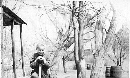 Cora Oyler standing outside a house