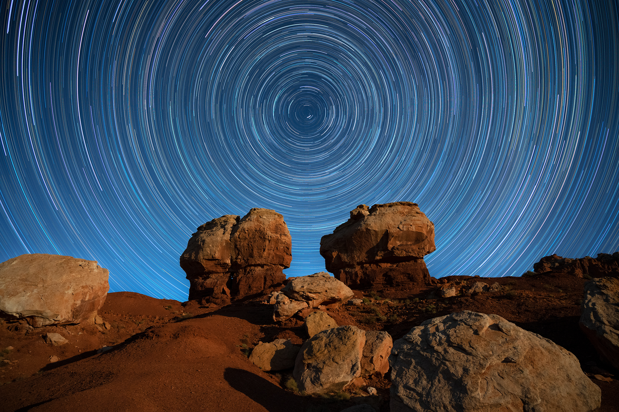 circumpolar star trails above twin rock formations