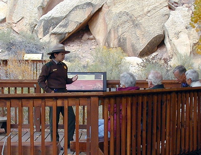 ranger presenting a talk at the petroglyph panel ranger presenting a talk at the petroglyph panel