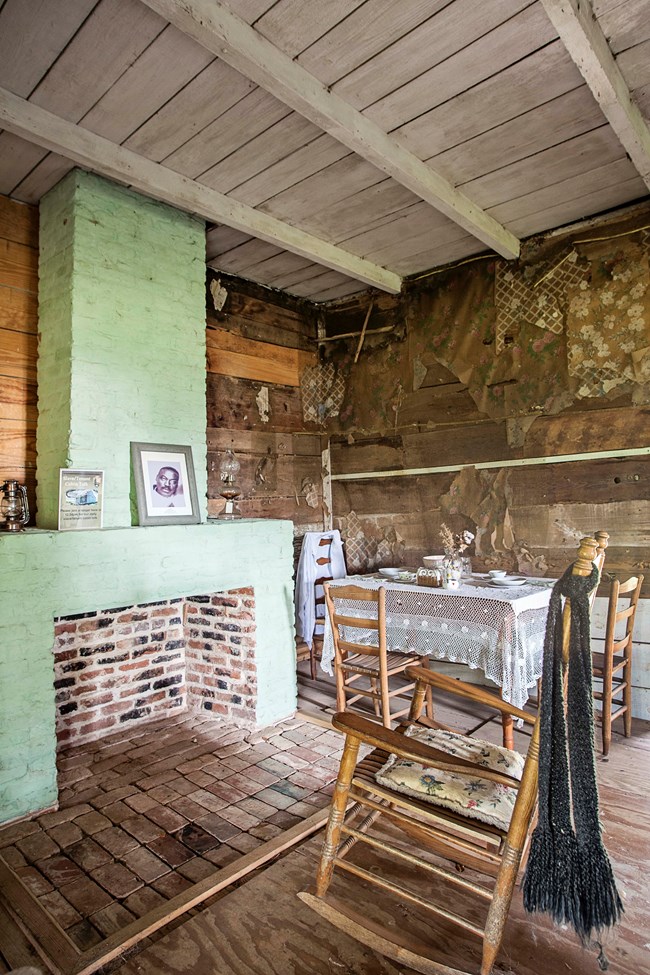 Interior of a slave/tenant cabin furnished to the 1950s period