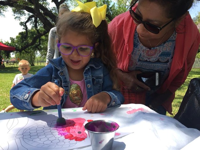 Child enagaged in painting activity