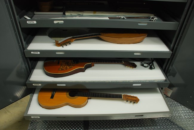 Guitars in storage in the museum preservation center