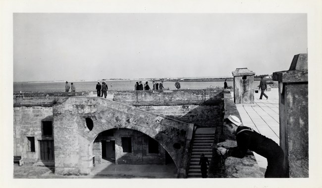 Civilians and servicemen visit the Castillo on December 7, 1941.