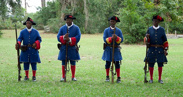 Four soldiers of African descent at Fort Mose.