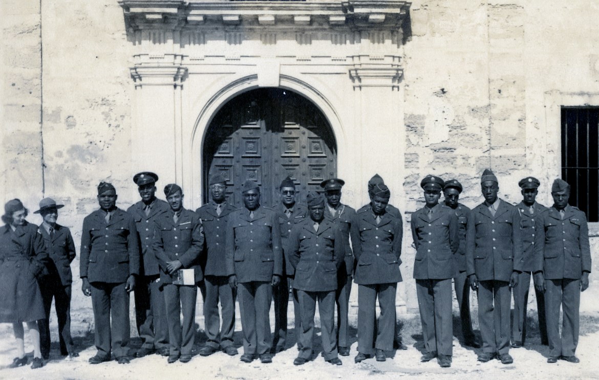 U.S. Coast Guard Visit Fort from a Convalescent Hospital in Daytona Beach and pose with Al Manucy in front of chapel.