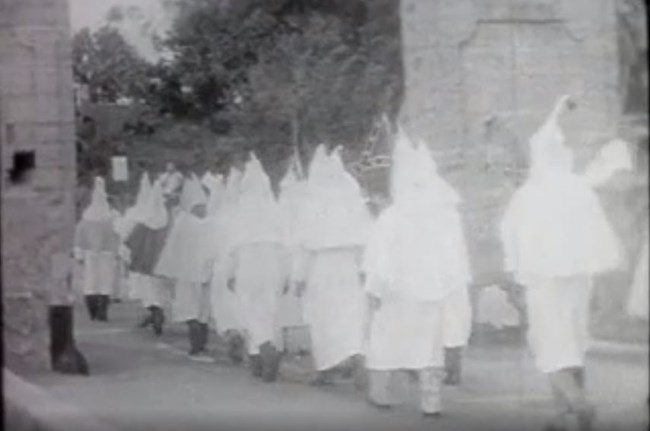 Ku Klux Klan march past the City Gate.