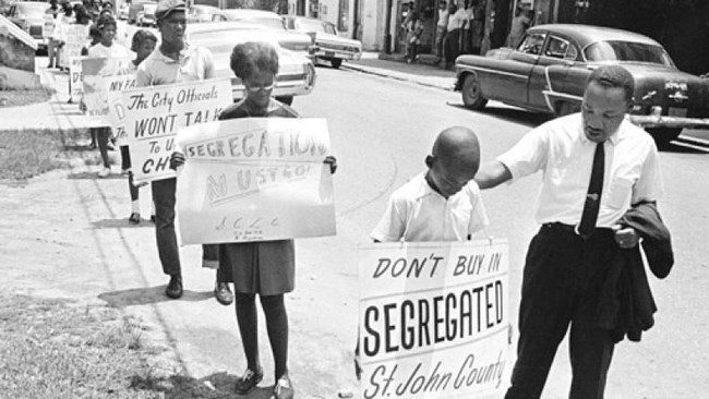 Martin Luther King Jr with children marching in civil rights movement in St. Augustine in 1964.