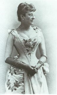 Black and white photograph of a woman in a dress.