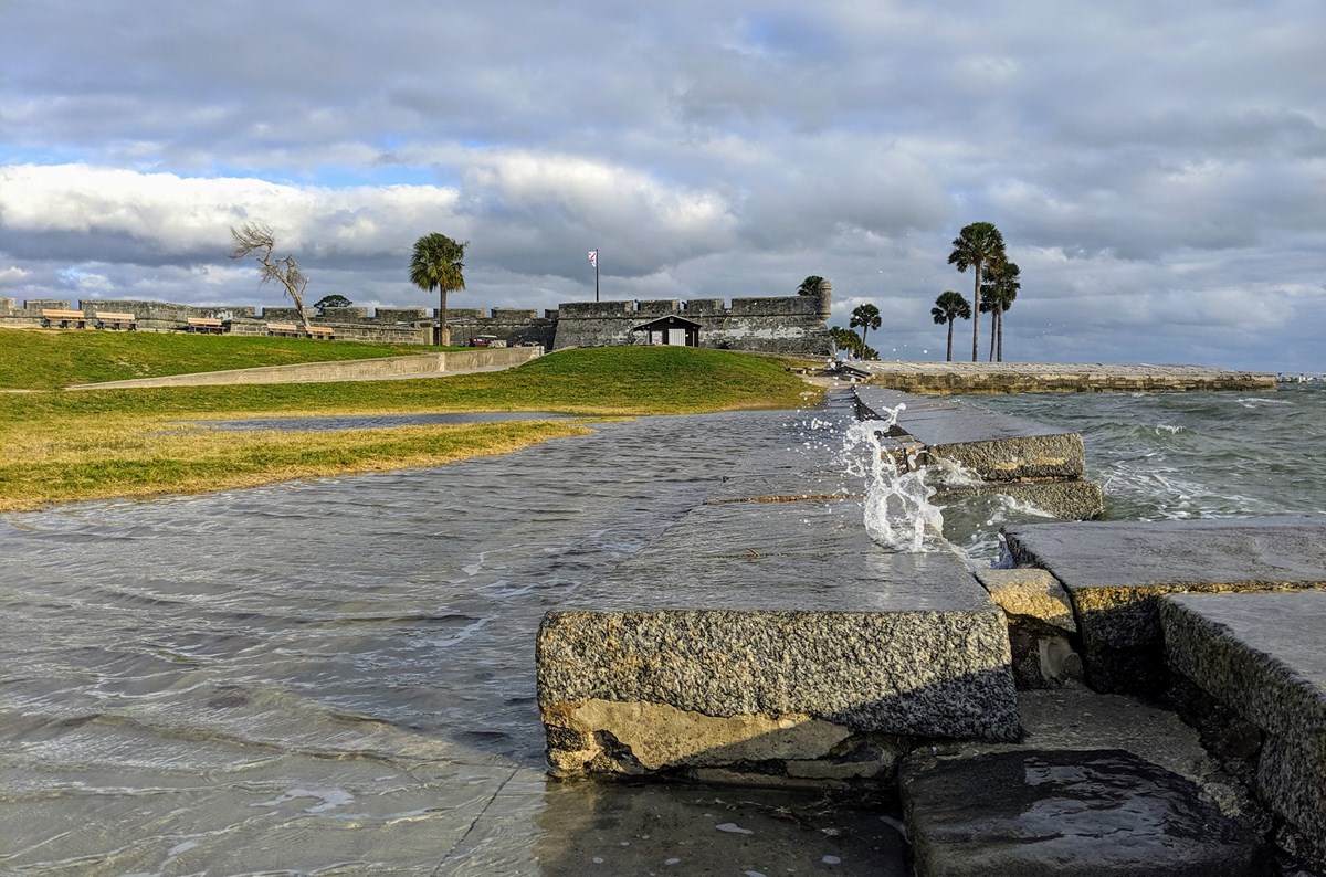 Taken on Nov. 13, 2019 of water crashing over the sea wall and flooding the park lawn.