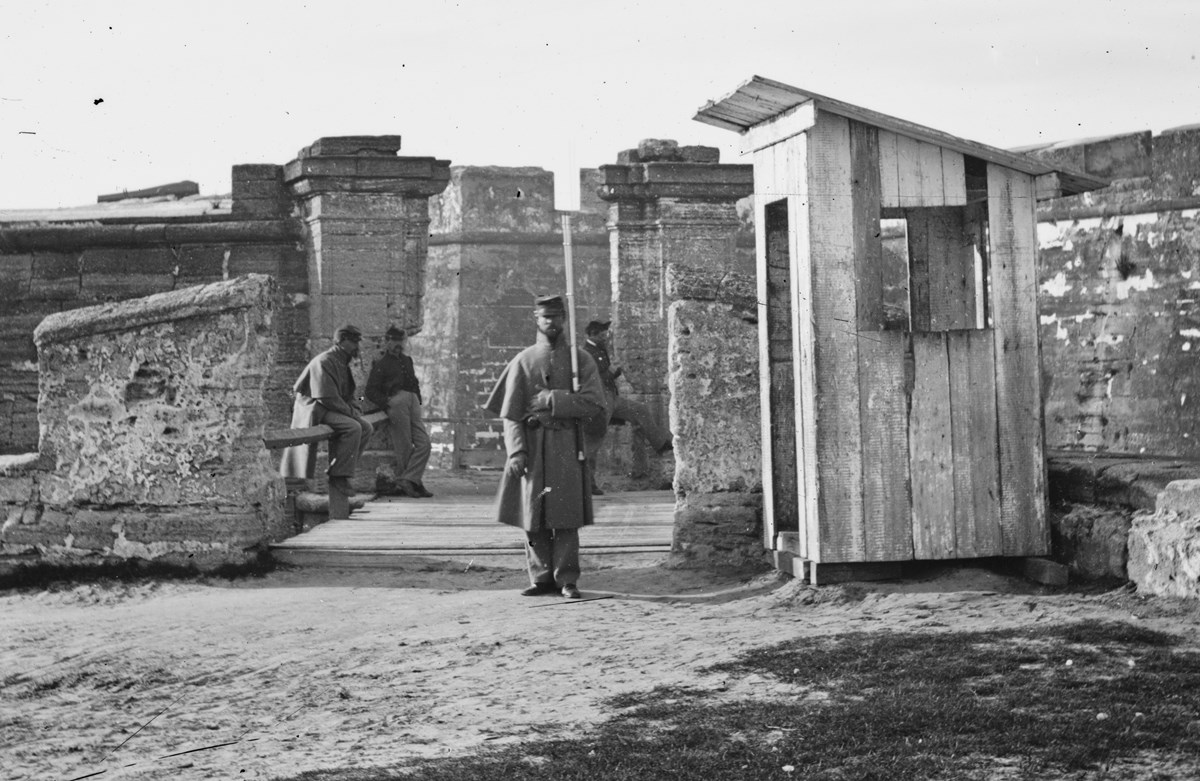 Union soldiers outside the fort near the first drawbridge.