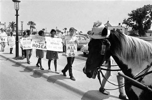 Black and white photograph of a Civil Rights March on Castillo's sidewalk.