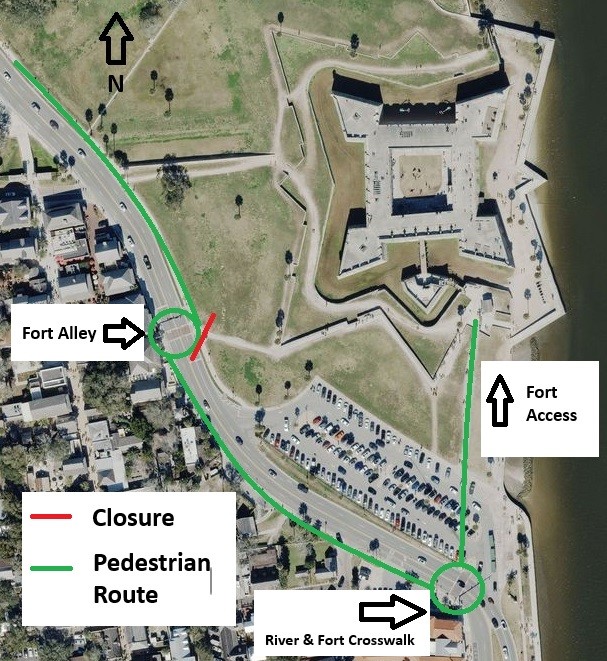 An aerial view of the Castillo grounds and parking lot with green lines to show the safe route for sidewalk usage and road crossing.