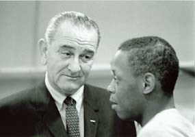 President Lyndon B. Johnson speaks to a corpsman, 1965.