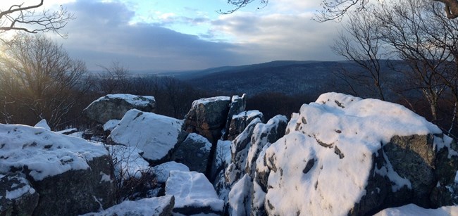 The Chimney Rock overlook at sunrise, with a light dusting of snow.