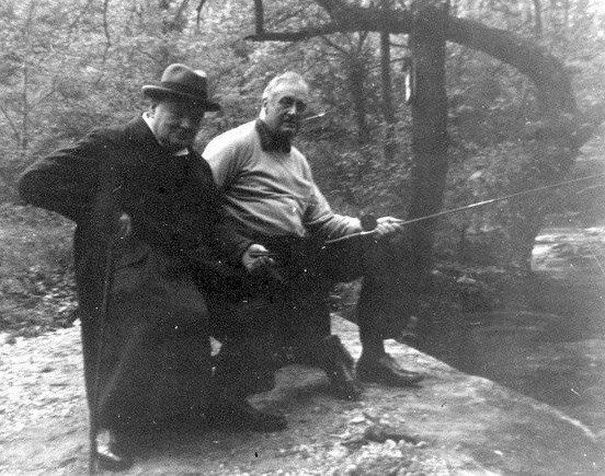 Winston Churchill and FDR fish on a rock alongside Big Hunting Creek