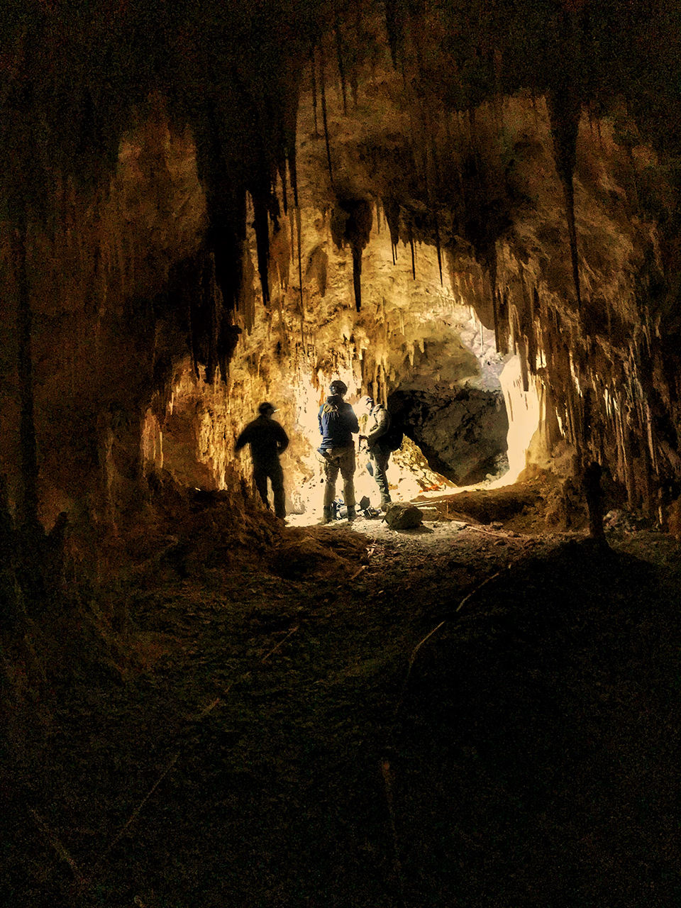 Photo of the an evaluation being conducted by bomb squad technicians in Ogle Cave.