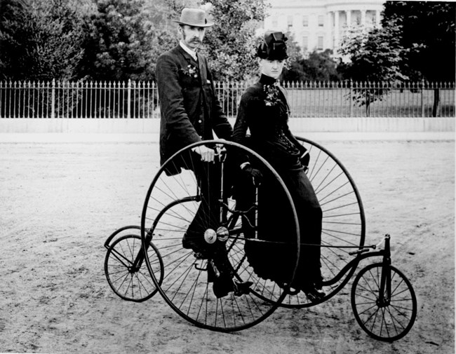 1886 couple on old fashioned quadracycle
