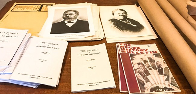 Associated Publishers Journal of Negro History and Negro History Bulletin on a table in the Woodson Home