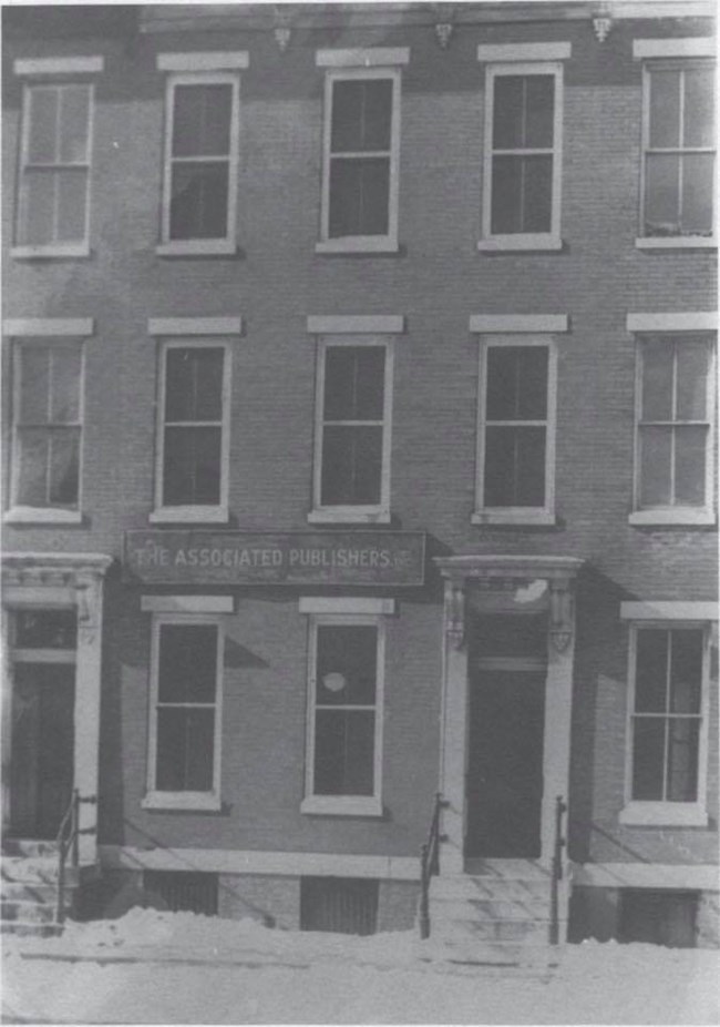 Front facade of 1538 Ninth Street, N.W. with Associated Publishers, Inc. sign