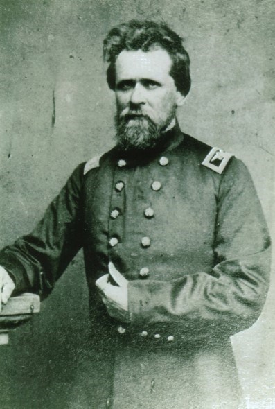 Colonel Joseph Thoburn An 1860s half-portrait photo shows a bearded army officer posing hand-in-waistcoat.