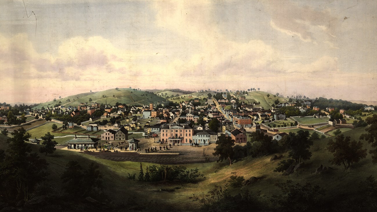 A mid 1800s lithograph print shows a painting of a valley town.