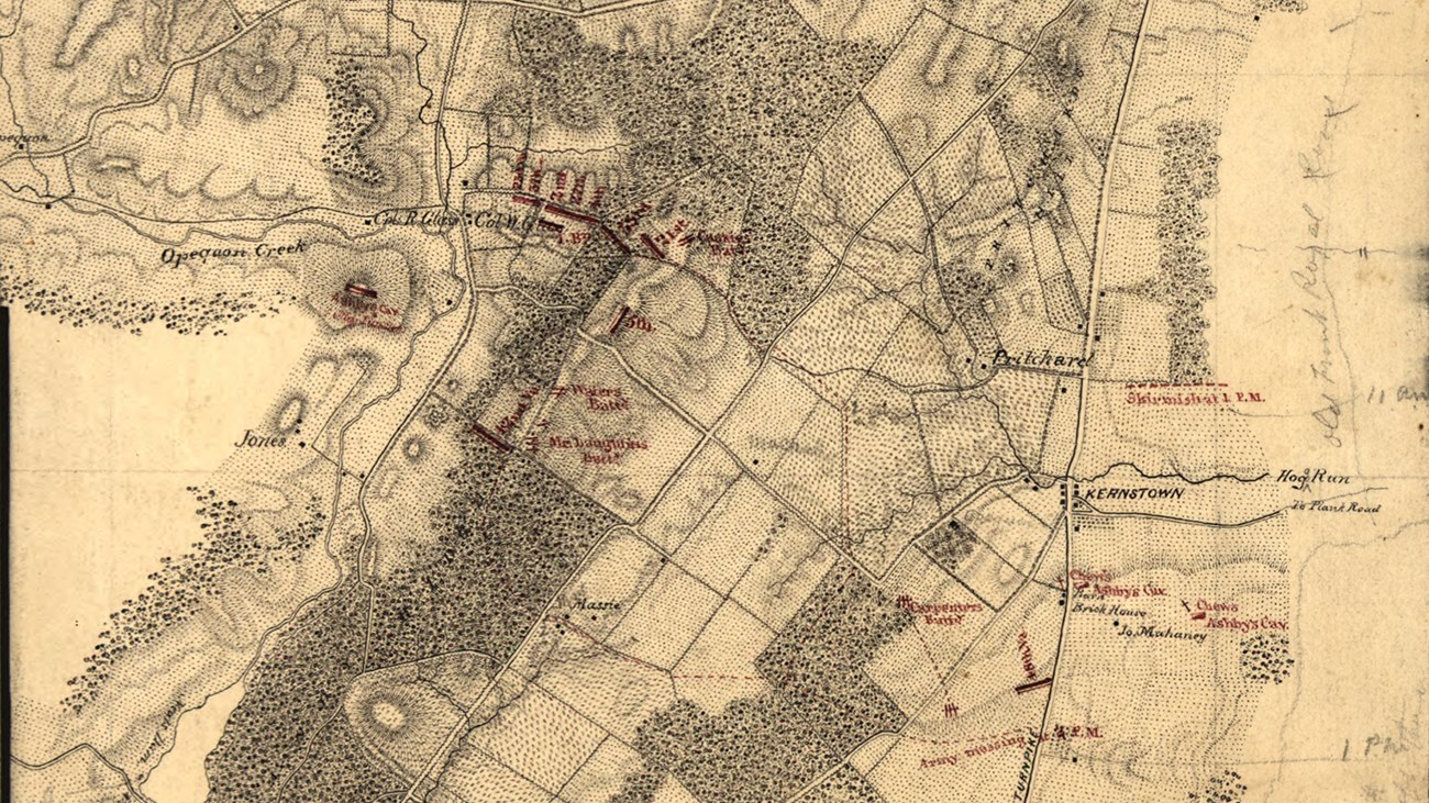 A yellowed 1800s map show terrain details with battle movements in red.