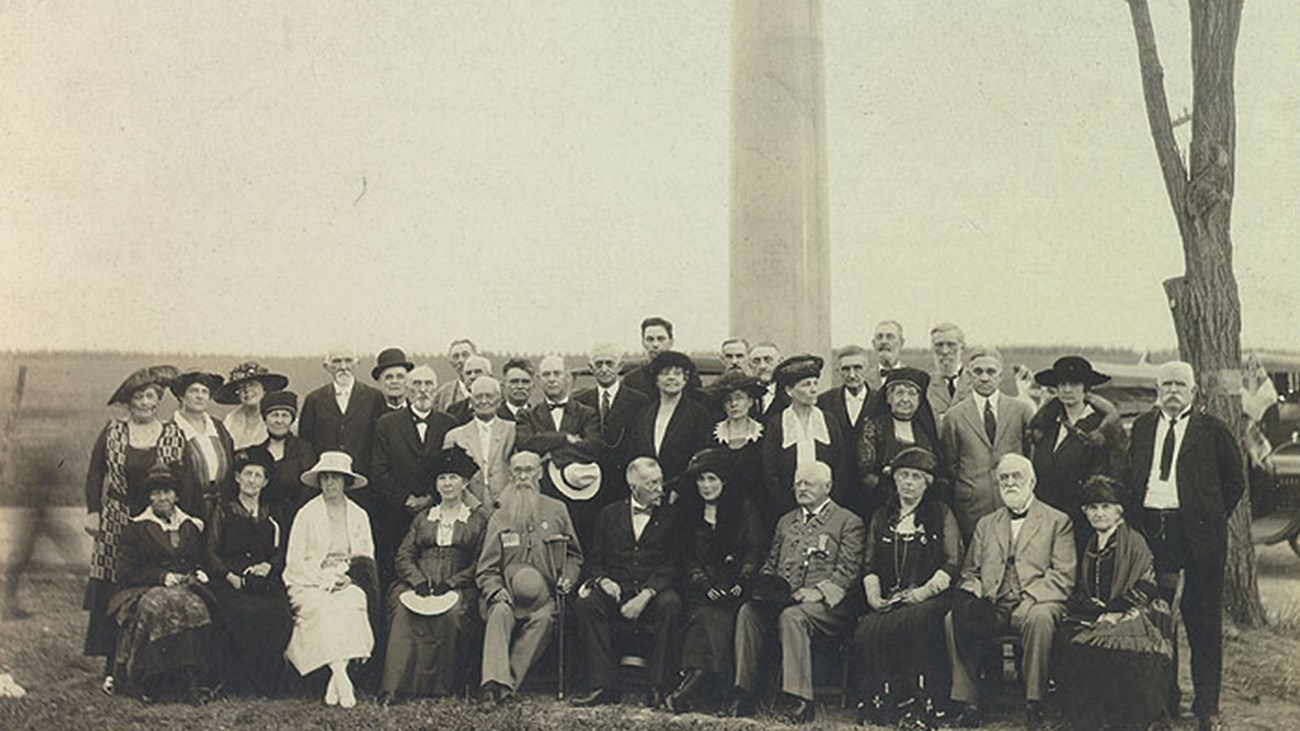 Ramseur Monument Dedication, 1920 A 1920 photo captures well dressed men and women gathered in front of a stone column war memorial.