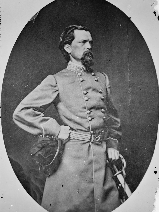 An 1860s portrait shows a bearded man in military officer's dress.