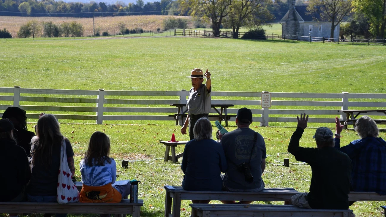 Park Ranger talk at Belle Grove Plantation A National Park Service Ranger presents a talk to a group of seated visitors.