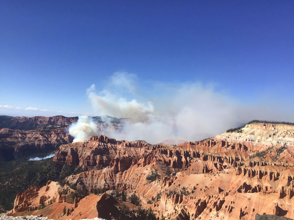 Chessman Canyon Fire - Sept 19, 2019 Chessman Fire Sept 19 - Smoke with forest and orange cliffs.