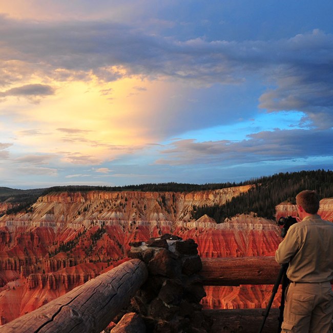 Man photographing Cedar Breaks Ampitheatere Man photographing Cedar Breaks Ampitheatere