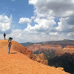 Child and man hiking on the rim of Cedar Breaks. Child and man hiking on the rim of Cedar Breaks.