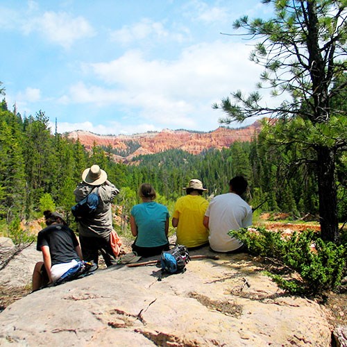 Group of people taking a break and enjoying the view. Group of people taking a break and enjoying the view.