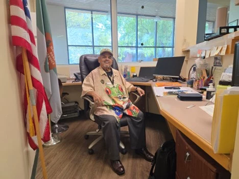 Don sitting at the front desk of the administrative office. Don sitting at the front desk of the administrative office.