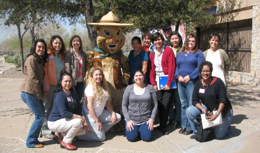 group of adults and ground squirrel mascot all facing you