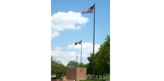 The flags of the United States and Mexico fly high at Chamizal National Memorial. The two nations came together in 1964 and peacefully settled their century-long border dispute.