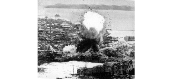 image of a U.S. Air Force B-52 Bomber bombing a Korean supply base, circa 1951.