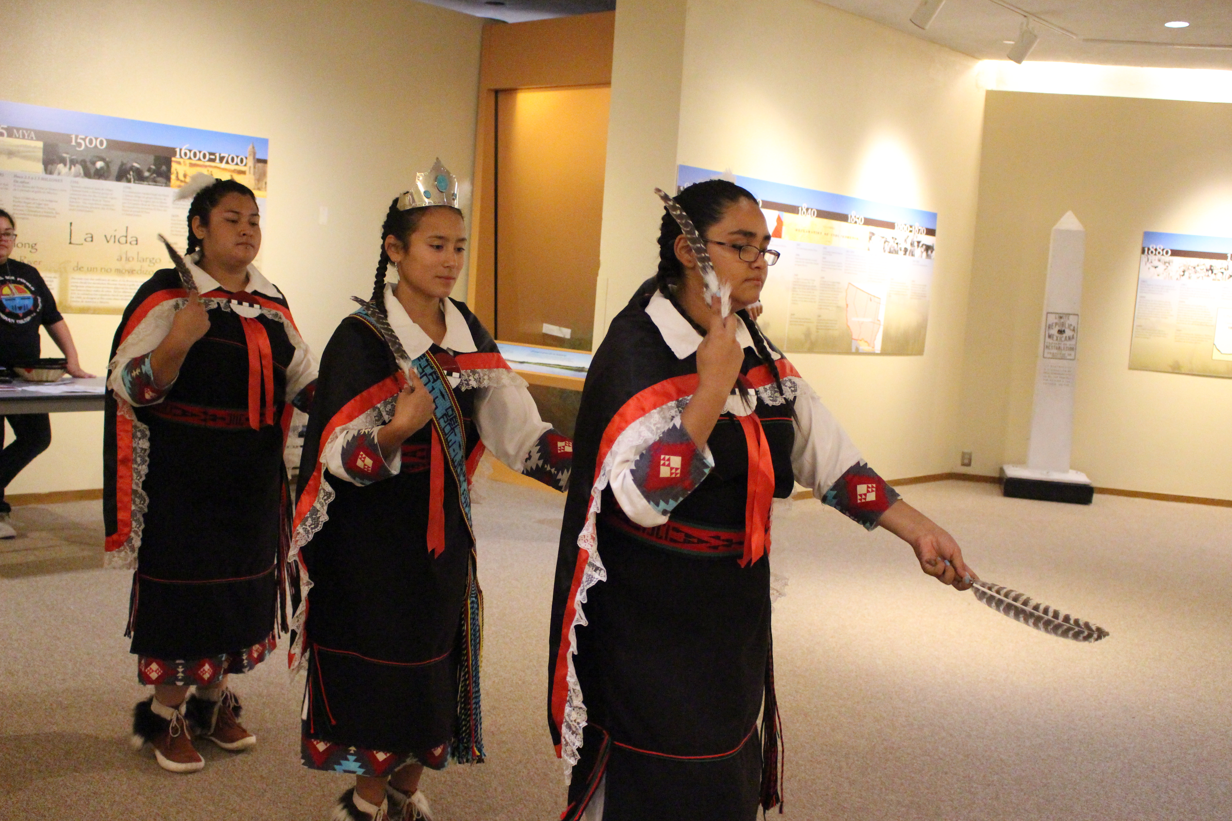 3 American Indian teen girls in traditional dresses
