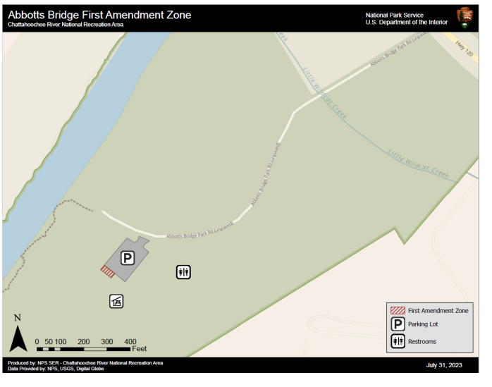 First Amendment Area is at end of parking lot closest to picnic tables.
