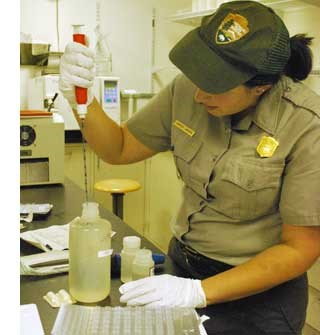 Biological Technician Candice La Russa performs test on water samples from the Chattahoochee River in the park's water lab.