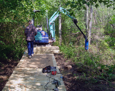 Track-hoe in use at Cochran Shoals boardwalk rehab work.